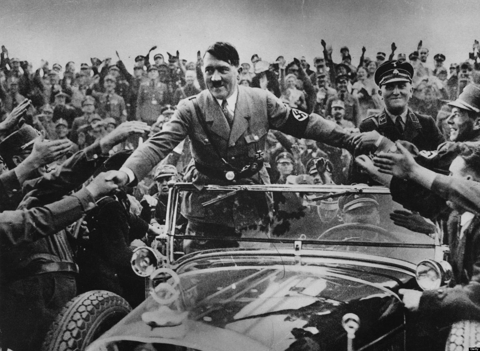 1933: Adolf Hitler (1889 - 1945), chancellor of Germany, is welcomed by supporters at Nuremberg. (Photo by Hulton Archive/Getty Images)