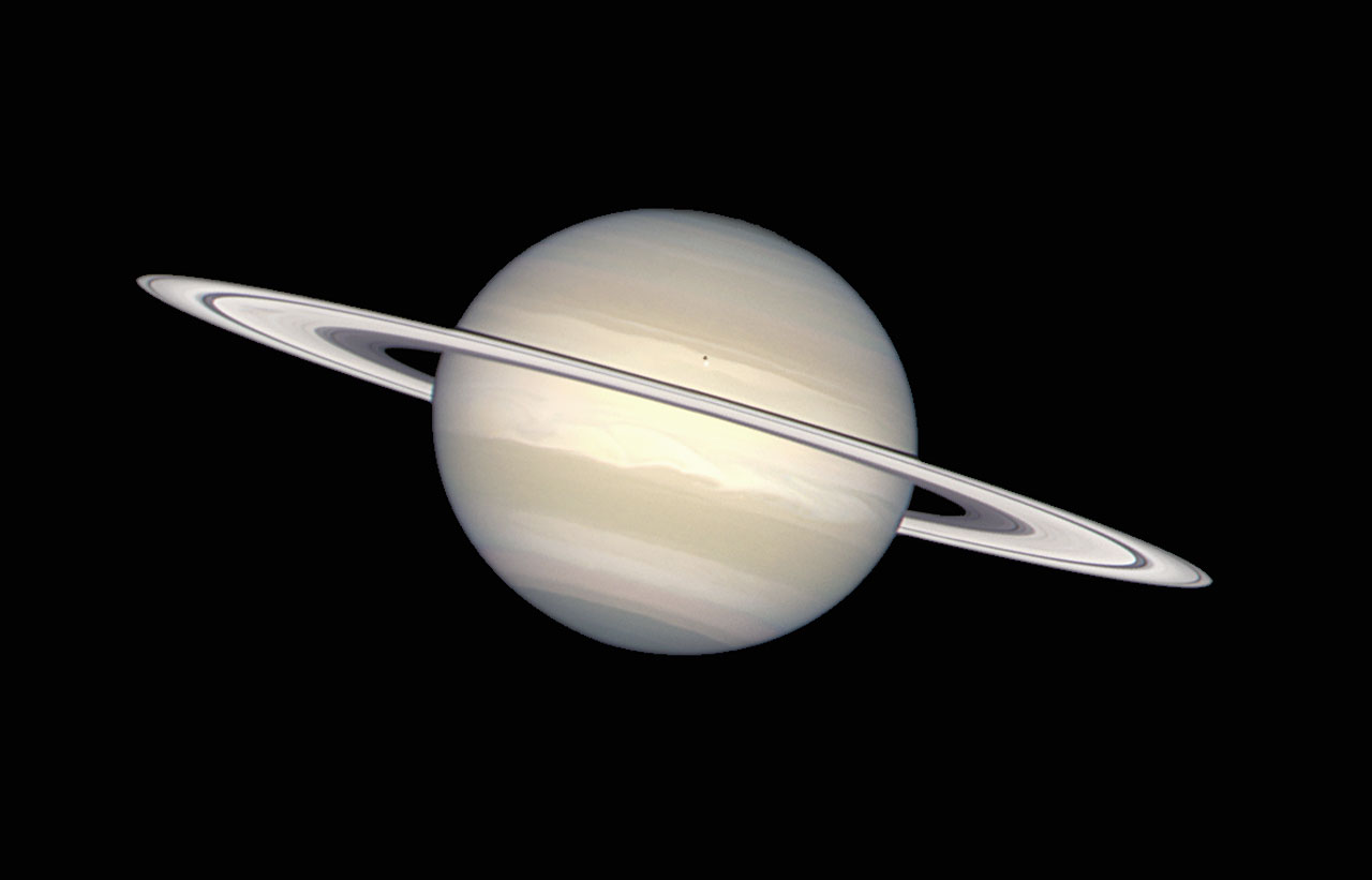The NASA/ESA Hubble Space Telescope has provided images of Saturn in many colors, from black-and-white, to orange, to blue, green, and red. But in this picture, image processing specialists have worked to provide a crisp, extremely accurate view of Saturn, which highlights the planet's pastel colors. Bands of subtle colour - yellows, browns, grays - distinguish differences in the clouds over Saturn, the second largest planet in the solar system.